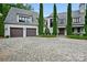 Elegant two-story home with a brick driveway, a two car garage, and beautiful landscaping at 11710 Ney Manor Way, Charlotte, NC 28277