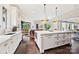 Open kitchen with large island, modern appliances, and an eat-in area at 11710 Ney Manor Way, Charlotte, NC 28277