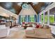 Living room with a vaulted ceiling, wood beams, and comfortable seating at 11710 Ney Manor Way, Charlotte, NC 28277