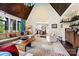 Open living room with a vaulted ceiling, wood beams, and comfortable seating at 11710 Ney Manor Way, Charlotte, NC 28277
