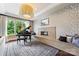 Living room with a piano, modern fireplace, and large windows, ideal for relaxation and entertainment at 11710 Ney Manor Way, Charlotte, NC 28277