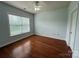 Bright, spacious bedroom featuring hardwood floors and a window, perfect for relaxing and resting at 129 Steinbeck Way, Mooresville, NC 28117