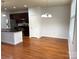 Inviting open floor plan with hardwood floors and kitchen with modern appliances at 129 Steinbeck Way, Mooresville, NC 28117