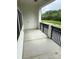 Private porch with a view of the pond and surrounding greenery at 129 Steinbeck Way, Mooresville, NC 28117