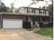 Charming two-story home with a brick facade, attached garage, and well-maintained front yard at 134 Crystal Cir, Mooresville, NC 28117