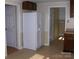 The kitchen features a white refrigerator and access to additional rooms, providing convenience and functionality at 134 Crystal Cir, Mooresville, NC 28117