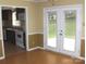 The eat-in kitchen includes access to the backyard and standard appliances at 134 Crystal Cir, Mooresville, NC 28117