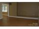 An expansive living room space is enhanced by a brick fireplace at 134 Crystal Cir, Mooresville, NC 28117