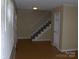 A large living room featuring access to the stairwell at 134 Crystal Cir, Mooresville, NC 28117