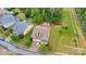 Aerial view of a home's backyard, showcasing a fire pit, mature trees, and a meticulously kept lawn at 1355 Cilantro Ct, Fort Mill, SC 29708