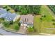 Aerial view of a brick home with a large lawn, fire pit, and mature trees at 1355 Cilantro Ct, Fort Mill, SC 29708