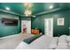 Bedroom with green walls, neutral carpet, an ensuite bath and view to the living room at 1355 Cilantro Ct, Fort Mill, SC 29708