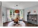 Cozy dining area with a modern light fixture and large windows providing natural light at 1355 Cilantro Ct, Fort Mill, SC 29708