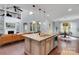 Spacious kitchen island with pendant lighting, overlooking the living room and dining area at 1355 Cilantro Ct, Fort Mill, SC 29708