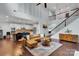 Open concept living area showcasing a kitchen, staircase, and comfortable seating at 1355 Cilantro Ct, Fort Mill, SC 29708