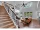 Inviting living room with a fireplace, high ceilings, and ample natural light, perfect for relaxation at 1355 Cilantro Ct, Fort Mill, SC 29708