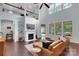 Inviting living room with a fireplace, high ceilings, and ample natural light, perfect for relaxation at 1355 Cilantro Ct, Fort Mill, SC 29708