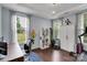 Bright home office featuring hardwood floors, ample natural light, and a functional workspace at 1355 Cilantro Ct, Fort Mill, SC 29708