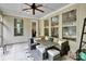 Covered patio featuring tile flooring and large wicker furniture at 1355 Cilantro Ct, Fort Mill, SC 29708