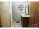 Bathroom features a toilet, vanity with mirror, and walk-in shower at 1565 Earnhardt Rd, Salisbury, NC 28146