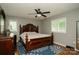 Comfortable bedroom with hardwood floors and natural light creating a relaxing space at 1565 Earnhardt Rd, Salisbury, NC 28146