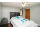 Bedroom with ceiling fan, window and a bed with black leather headboard and wood floors at 1565 Earnhardt Rd, Salisbury, NC 28146