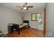 Bedroom featuring ceiling fan, hardwood floors and one bed with a black frame at 1565 Earnhardt Rd, Salisbury, NC 28146