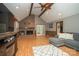 Spacious living room with vaulted ceiling, wood beams and a cozy brick fireplace at 1565 Earnhardt Rd, Salisbury, NC 28146