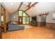 Open-concept living room with natural light, wood floors, and vaulted ceiling at 1565 Earnhardt Rd, Salisbury, NC 28146