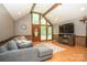 Inviting living room featuring wood floors, vaulted ceilings, and A-frame entrance at 1565 Earnhardt Rd, Salisbury, NC 28146