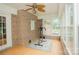 Charming sunroom with large windows and a ceiling fan for comfortable relaxation at 1565 Earnhardt Rd, Salisbury, NC 28146