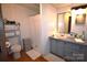 Cozy bathroom featuring a toilet, vanity, and shower with white curtain, offering a clean and functional space at 1789 Paris Dr, Conover, NC 28613