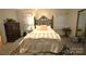 Inviting bedroom featuring a decorative bed frame, dresser, and ample natural light at 1789 Paris Dr, Conover, NC 28613