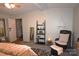 Relaxing bedroom with a cozy chair, decorative shelving, and a serene atmosphere at 1789 Paris Dr, Conover, NC 28613