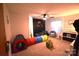 Bright bedroom features dinosaur decor, a bed, and a colorful play tunnel at 1789 Paris Dr, Conover, NC 28613