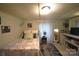 Charming bedroom with a comfy bed, sheer curtains, and a vintage fan, offering a peaceful and relaxing retreat at 1789 Paris Dr, Conover, NC 28613