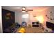 Cozy bedroom features a bed, dinosaur decor, and a comfortable beanbag chair at 1789 Paris Dr, Conover, NC 28613