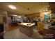 Inviting kitchen with an island, stainless steel appliances, wood cabinets, and an open view to the dining area at 1789 Paris Dr, Conover, NC 28613