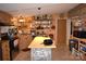 Cozy kitchen with wood cabinets, stainless appliances, center island, and open shelving at 1789 Paris Dr, Conover, NC 28613