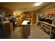 Inviting kitchen features a center island, stainless appliances, ample storage, and decorative shelving at 1789 Paris Dr, Conover, NC 28613