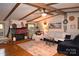 Bright living room with hardwood floors, fireplace, and comfortable seating, creating a cozy atmosphere at 1789 Paris Dr, Conover, NC 28613