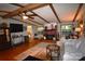 Bright and airy living room boasts wood floors, ceiling beams, and a cozy fireplace for a comfortable atmosphere at 1789 Paris Dr, Conover, NC 28613