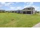 Expansive backyard perfect for outdoor gatherings with a lush lawn and screened in porch at 1818 Winding Mist Dr, Belmont, NC 28012