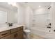 Bathroom with tub and shower combo and neutral ceramic tile flooring at 1818 Winding Mist Dr, Belmont, NC 28012