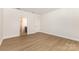 Spacious bedroom with hardwood floors and ample natural light, ready for personalization at 1818 Winding Mist Dr, Belmont, NC 28012