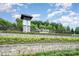 Del Webb Carolina Riverside community entrance with manicured landscaping at 1818 Winding Mist Dr, Belmont, NC 28012