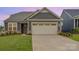 Charming home with a gray exterior, well-manicured lawn, and spacious driveway at 1818 Winding Mist Dr, Belmont, NC 28012