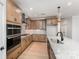 Contemporary kitchen with stainless steel appliances, granite countertops, and an island with a sink at 1818 Winding Mist Dr, Belmont, NC 28012