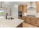 Modern kitchen featuring stainless steel appliances, quartz countertops, and custom cabinetry at 1818 Winding Mist Dr, Belmont, NC 28012