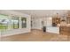 Bright and open living space featuring recessed lighting, large windows, and kitchen with stainless steel appliances at 1818 Winding Mist Dr, Belmont, NC 28012